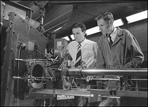 Physicist Eugene Gardner, right, at work with fellow scientist C.M.G. Lattes in 1948. Mr. Gardner died two years later at age 37 of beryllium disease, spending his last months inside an oxygen tent.