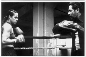 Diana Guzman (Michelle Rodriguez) in the ring with Hector (Jaime Tirelli), her trainer, in Karyn Kusama's 