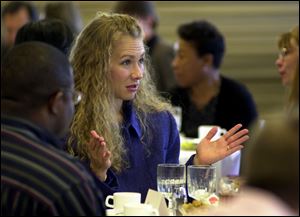 As a biracial person, `I often felt alone and misunderstood,' Elizabeth Atkins Bowman tells faculty and staff members at Bowling Green State University.