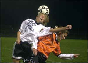 Northview's Sarah Szczepaniak gets the upper hand, and head, in a battle with Abby Holzworth of North Olmsted.