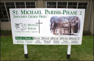 A sign outside St. Michael's Church on Findlay's east side gives a timeline for the work.