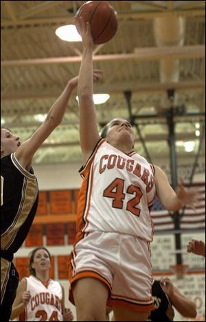 Southview's Kelly Heil glides in for a basket against Perrysburg. Heil scored 27 and now has 1,015 for her career.