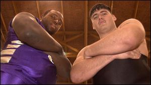 Tarrell Baldwin, left, plays center on the basketball team at 6-5, 324. Rick Cannings wrestles at 275, down 25 from football.