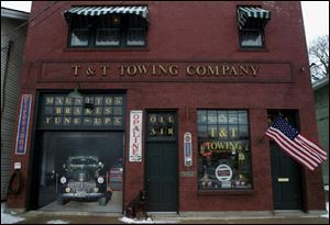 John Taylor bought his hose in 1995 with plans to restore it. He learned soon afterward that an auto paint and repair shop had been on the first floor. That led him to renovate the 1920s building in an automotive motif.