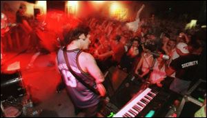 Crowds cheer wildly during a 1999 concert at the Main Event in East Toledo on Main Street.