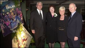 Guest of honor Penny Marks, second from left, at her retirement party with, left, husband Emil, and hosts Diane and Don Breese at Inverness Club.