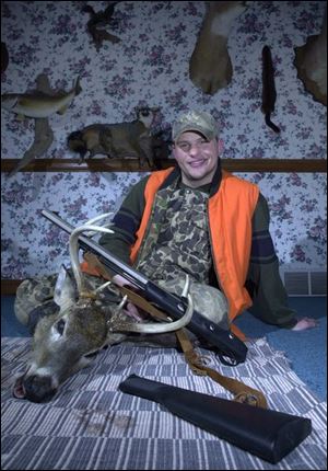 Matt Langlois broke his muzzle-loader in half when striking this buck while trying to fend off its attack. A friend in his hunting party had already shot and wounded the buck. Langlois was trying to make a killing shot when his weapon misfired.