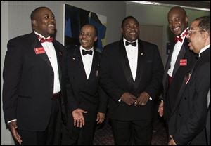 LISTEN, BROTHERS: Kappa Alpha Psi Fraternity officials Dr. Kevin Bailey, left, Robert Selvey, Samuel C. Hamilton, Michael Whitted, and Eiken Glass, Jr., at the convention.