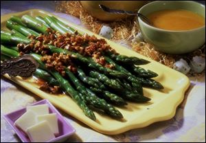 Asparagus with Browned Butter-Pecan Sauce is a tasty spring dish.