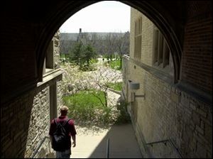 ROV UT 042501 1  April 25, 2001--A student leaves University Hall and into a bright, sunny day Wednesday at the University of Toledo. Blade photo by Andy Morrison