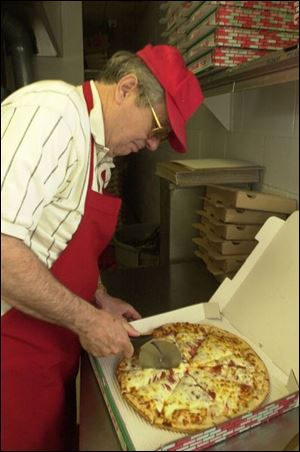 Bill Kakmis must raise South End Pizza's delivery charge.