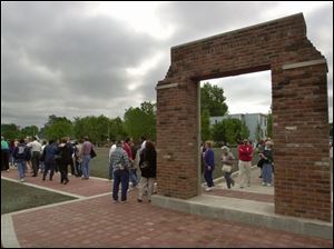 CTY May 12, 2001 - Visitors view the labor memorial at the site of the former Electric Auto-Lite plant prior to its dedication Saturday Saturday morning.   Bricks from the old plant, located at Champlain and Elm Streets, were used in the construction of the memorial.  Blade photo by Dave Zapotosky