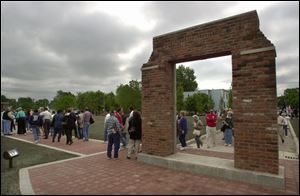 CTY May 12, 2001 - Visitors view the labor memorial at the site of the former Electric Auto-Lite plant prior to its dedication Saturday Saturday morning.   Bricks from the old plant, located at Champlain and Elm Streets, were used in the construction of the memorial.  Blade photo by Dave Zapotosky