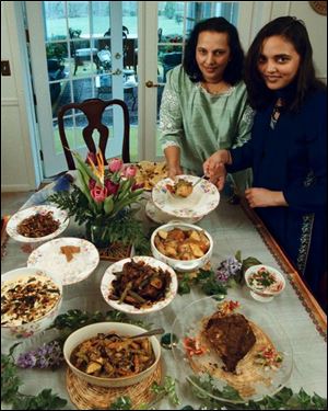 In New York last month, Judy Padamadan cooked Keralan dishes like appam. Here, she and her mother, Geeji, are shown with similar foods they made last year.