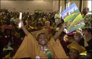 Life is good when you are 6 and just graduated from kindergarten  at Washington Kendergarten Center on Palmwood Ave. in Toledo as Lemuel Edwards shows us. He also has an attendance award to go with his diploma. Dutton CTY kinder04p 1 JUNE 4 2001