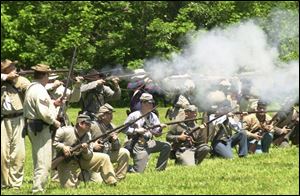 Confederate troops at Fort Meigs? These re-enactors join forces with Doughboys of World War I, GIs of World War II, soldiers of Rome, and Desert Storm fighters on the field of living history.
