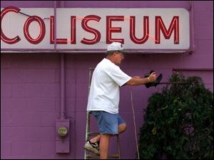 ROV trim 01 - June18, 2001. Owner of the Swanton Coliseum, Gene Bridges trims the bushes in fron of his business which is on Rt 2 in Swanton. The Coliseum has been in the family since 1957, and was first built by his inlaws Bob and Dorothy Wyse. The Blade/Allan Detrich