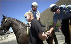 Toledo police arrest Jeff Farby of Detroit for disorderly conduct.