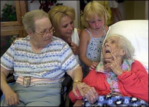 At 114, Maud Farris-Luse's life spans generations. From left, her only surviving daughter, Lucille Bull, granddaughter Cindy Hewes, and great-granddaughter Cierra Hewes visit.