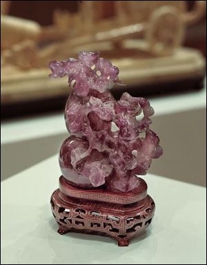 A carved purple quartz gourd with grape flourish is one of a collection of 68 Oriental artworks given to the Fire- lands campus by a Huron-area family.