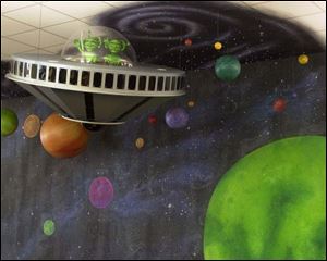 Space aliens greet young readers to the Children's Library's main room.