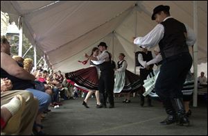 The Kodaly ensemble of Toronto performs Hungarian dances under a tent during the Birmingham Ethnic Festival.