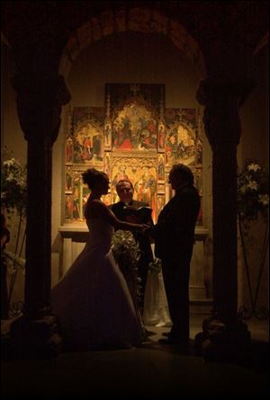 The Cloisters at the Toledo Museum of Art provides a romantic setting for the marriage of Erin Harshman and Mark Mitchell.