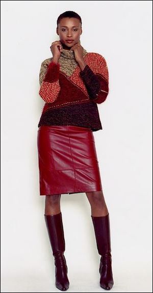 Sigrid Olsen's fall collection includes a cowl neck pullover sweater with a leather skirt and boots.