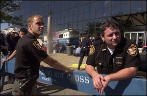 Lucas County sheriff's deputies Steve Gadoury, left, and Steve Meehan, outside the Jacob Javits Conference Center, were almost overwhelmed by the sight of the death and destruction.