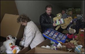 Carol Retcher, associate pastor, and Jim Fry, pastor of Free Christian Church of God in Continental, help load toys bound for New York and the families of victims in the Sept. 11 attacks on the World Trade Center.