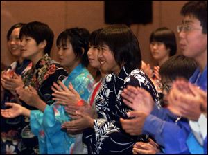 cty kids10p October 9, 2001. Twenty three 7th and eighth graders from Toyohashi Japan sing songs Tuesday night at the Wyndam Hotel. blade photo by Jeremy Wadsworth