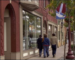 Bowling Green State University students take in the shops on Conant Street in Maumee.