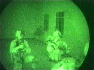 U.S. special forces are seen inside a building at an unspecified location believed to be near Kandahar in Afghanistan.