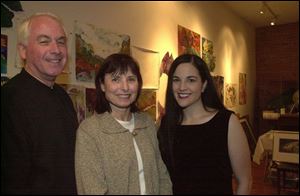 Artists John Luscombe, Kay Weprin, center, and Leslie Adams enjoy the Holiday Open House at 20 North Gallery.