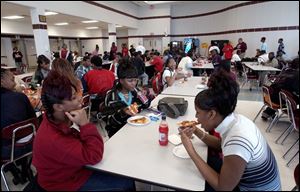 Sophomores Tammie Sanders, 16, Shontel Piggee, 17, and Ebony Thurmond, 16, from left, have lunch in the cafeteria that was added on to Scott High School two years ago.