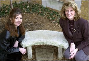 `It's an incredible tale,' says Jane Bradley, left, an author and associate professor of English at the University of Toledo, with Penny Carr Britton beside a memorial for Mrs. Britton's daughter at Blessed Sacrament Church.