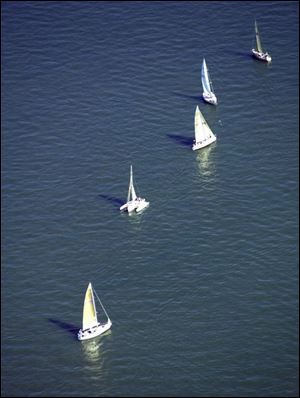 Sailboats compete in the Mills Trophy Race from Harbor Light to Put-in-Bay in June. About 150 boats entered the race.