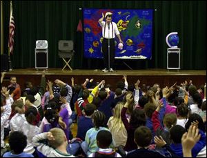 Gordon Russ gets a rise from his audience during a performance at Old Orchard Elementary School.