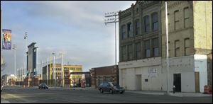 The former Brenda's Body Shop, right, is just a baseball's throw from Fifth Third Field.