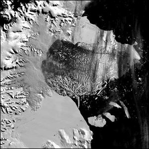 The Larsen B ice shelf, a large floating ice mass on the eastern side of the Antarctic Peninsula, has shattered and separated from the continent In this fourth of four images of the breakup taken March 5, 2002 by NASA's Terra satellite. The ice shelf has existed since the last Ice Age 12,000 years ago collapsed this month with staggering speed during one of the warmest summers on record there, scientists say. The collapsed area was designated Larsen B, and was 650 feet thick and with a surface area of 1,250 square miles, or about the size of Rhode Island.