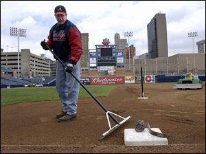 SPT April 1, 2002 - Jared Kent, assistant groundskeeper, grooms the infield at  Fifth Third Field Monday afternoon.  Players reported Monday and first practice is Tuesday.  Blade photo by Dave Zapotosky