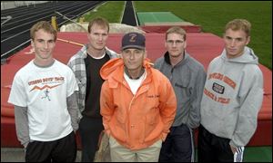 Tim Downey, center, coaches at Otsego High School and BGSU. Four of his sons - from left, Ethan, Shawn, Travis and Drew - are also pole vaulters and coaches.