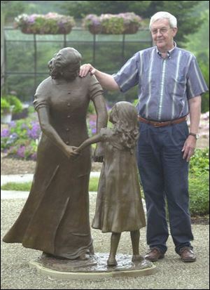 Dick Boers, former city forestry department head who helped plan the gardens, becomes a third party to the new sculpture Empathy.