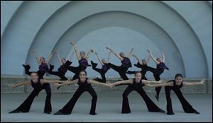 Members of the Cassandra Ballet of Toledo practice in the Toledo Zoo Amphitheater for Sunday's performance. This will be the 20th season of zoo appearances by Cassandra Macino's dance company.
 