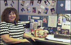 Amy Campbell decorated her office at AAA of Northwest Ohio with photographs of her two children and Campbell Soup memorabilia.