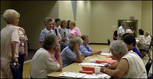 Senior citizens wait to receive vouchers for produce at the Sylvania Senior Center.