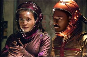 Rosario Dawson and Eddie Murphy play, respectively, a waitress and nightclub owner in The Adventures of Pluto Nash.