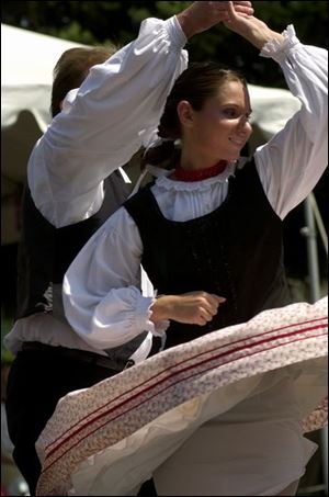 Paul Soltesz and Ann Rezbanyay, both of Oregon, perform a traditional dance at the Birmingham Ethnic Festivals.