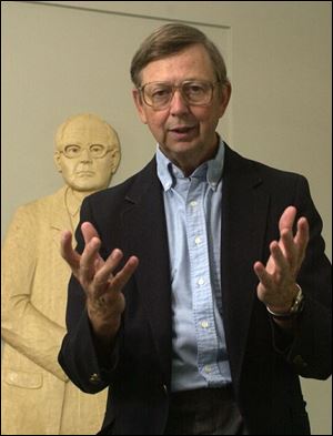 The Rev. Jim Bacik, standing in front of a sculpture of his mentor, Karl Rahner, says the U.S. should seek justice, not war.