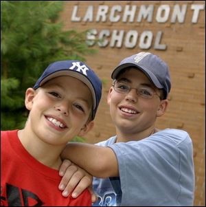 `It can be kind of scary sometimes,' says Mark DeNucci, Jr., right, with his brother, Andy, at Larchmont Elementary. Mark this week began attending DeVeaux Junior High.